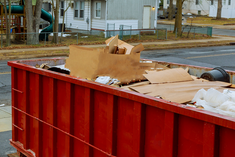 construction dumpster filled with debris